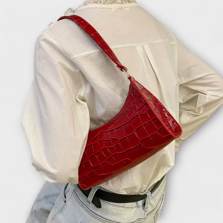 Léora. Skinnende Lædertaske