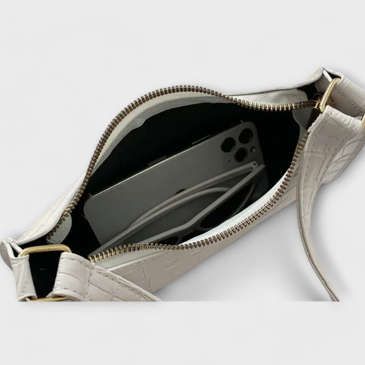 Léora. Skinnende Lædertaske