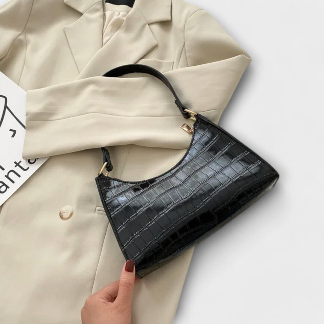 Léora. Skinnende Lædertaske