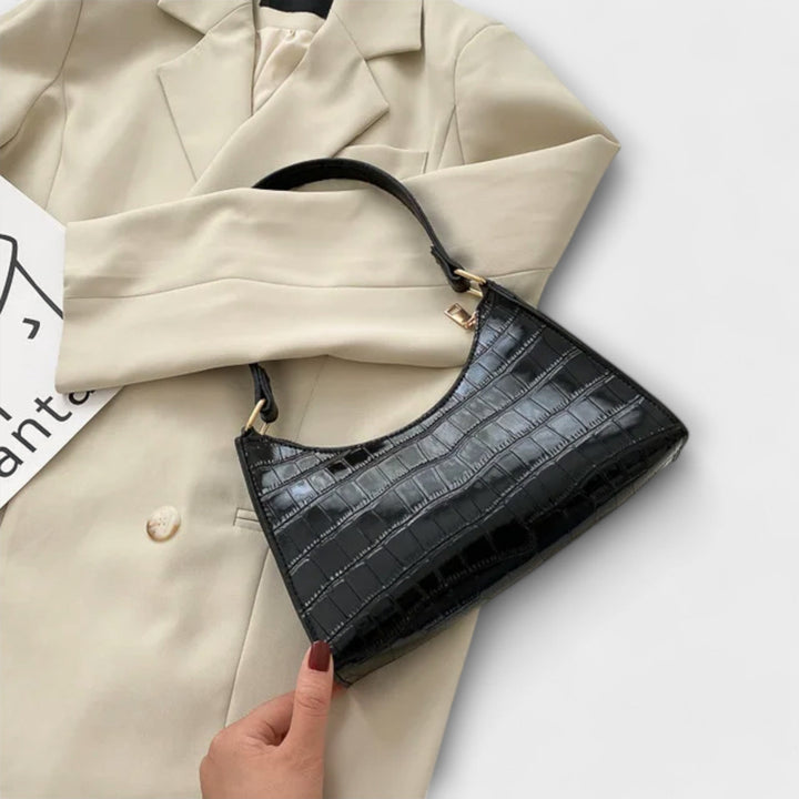 Léora. Skinnende Lædertaske