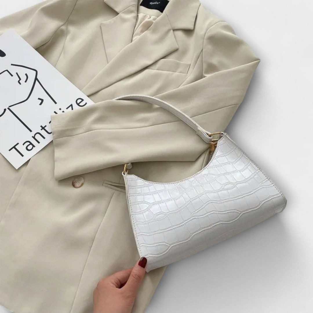 Léora. Skinnende Lædertaske