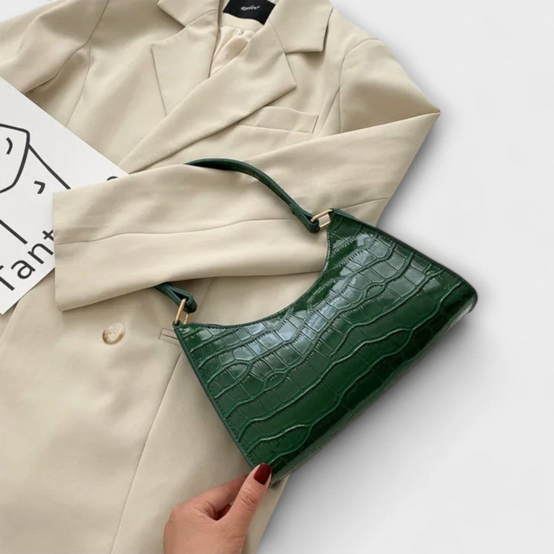 Léora. Skinnende Lædertaske