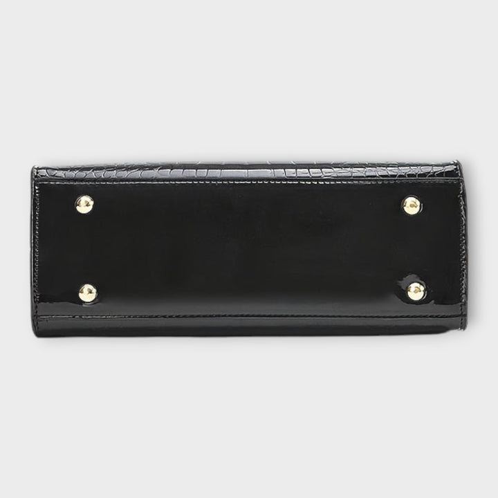 Léora. - Glansfuld håndtaske med krokodillelædermønster